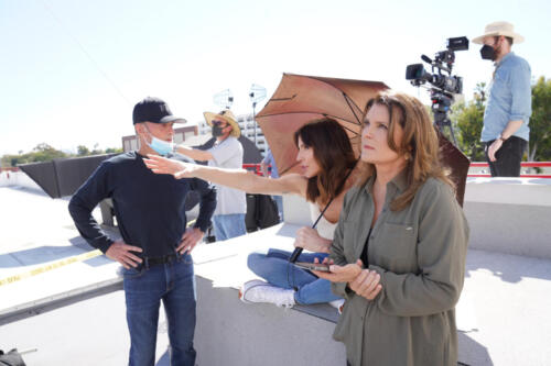 Krista and Kimberlin getting some direction on how Taylor's fall over the building will be taped.