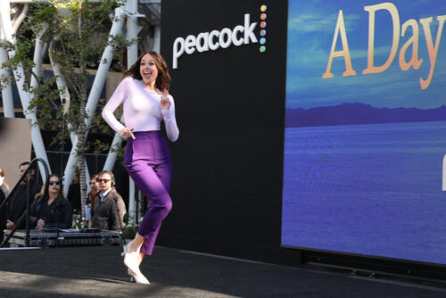 Abigail Klein jogging onto the stage.